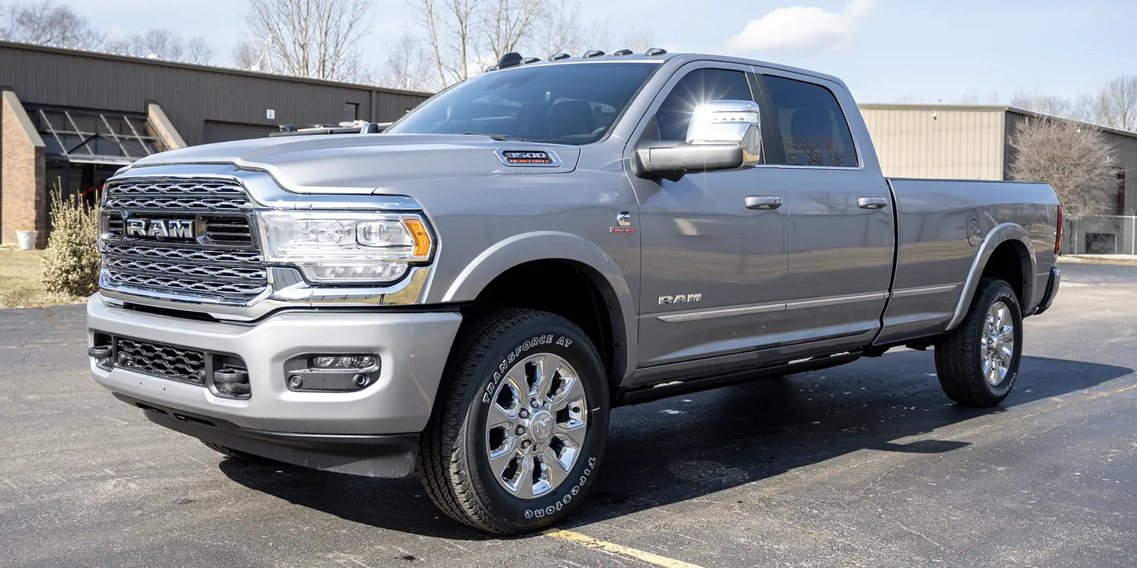 The exterior of a gray 2024 Dodge Ram 3500 offered by Luxe Trucks.
