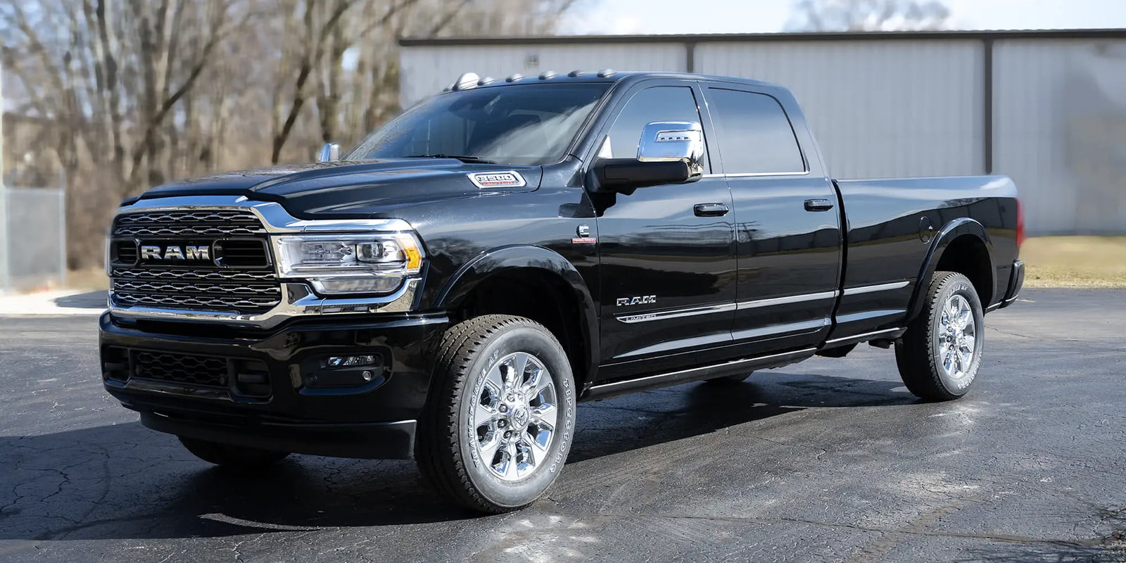 The exterior of a black 2024 Dodge Ram 3500 offered by Luxe Trucks.