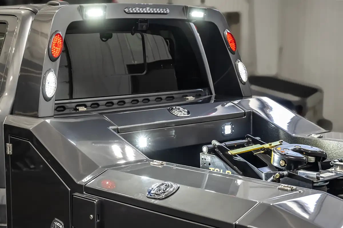 Close-up view of Rigid lights on a Luxe Truck's Light Pylon, brightening the bed area—vital for the nighttime functionality of fifth wheel hauler trucks used in RV towing.