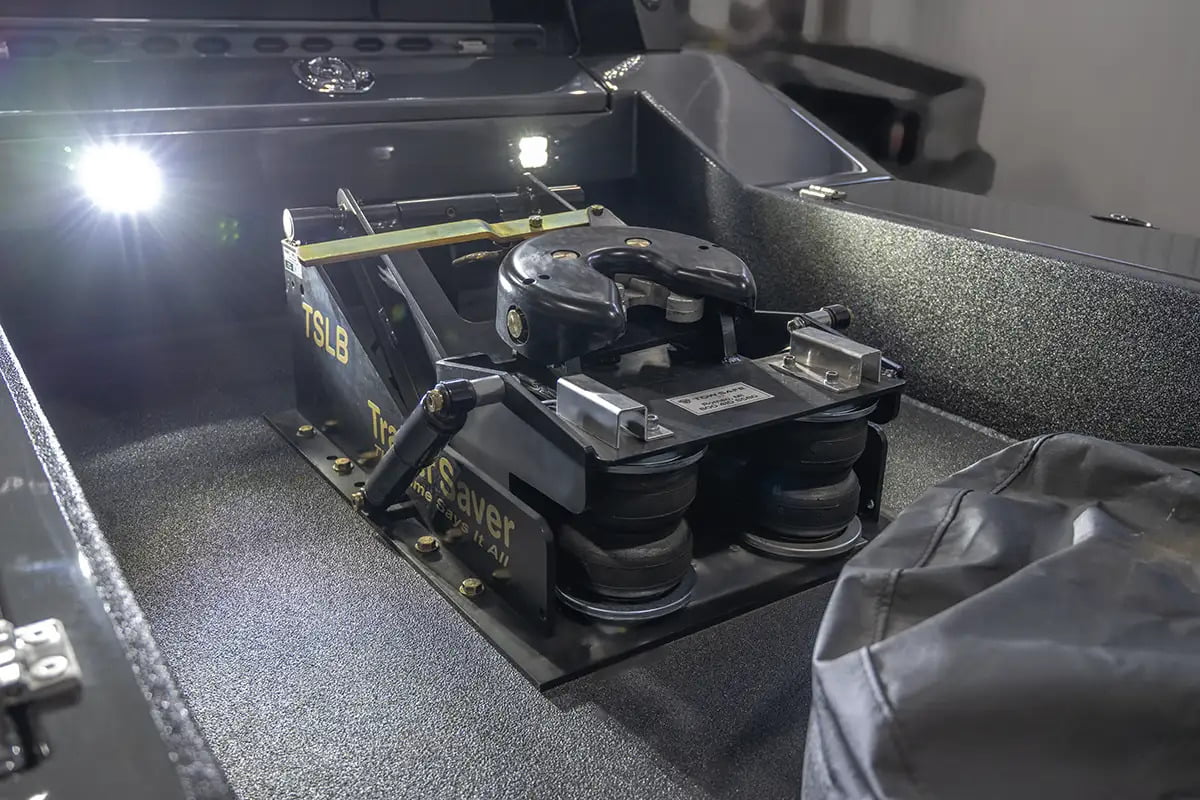 Close-up of a Trailer Saver 3rd Airbag hitch mounted in a Luxe Truck bed, showcasing an essential accessory for a fifth wheel hauler truck designed for RV towing.